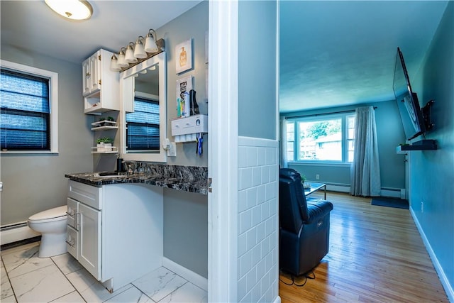 111 Belgium St, Cranston, RI 02920 - bathroom with vanity, a baseboard radiator, and marble finish flooring