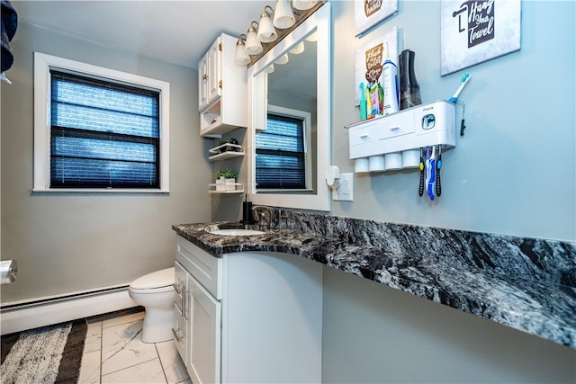 111 Belgium St, Cranston, RI 02920 - bathroom with a baseboard heating unit, marble look tile flooring, healthy amount of natural light, and vanity