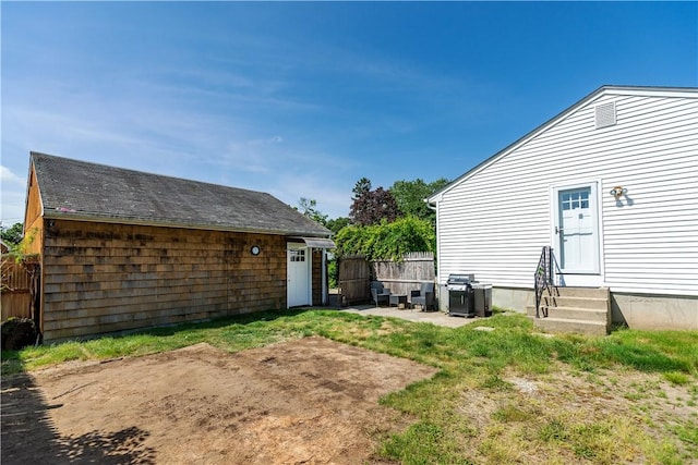111 Belgium St, Cranston, RI 02920 - rear view of house featuring entry steps and a patio area