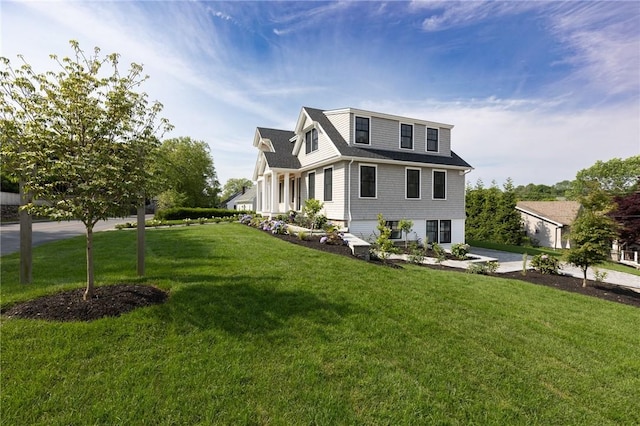 35 Coggeshall Ave, Newport, RI 02840 - view of front facade featuring a front yard and a shingled roof