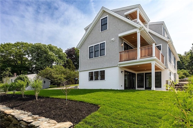 35 Coggeshall Ave, Newport, RI 02840 - back of house with a balcony and a lawn