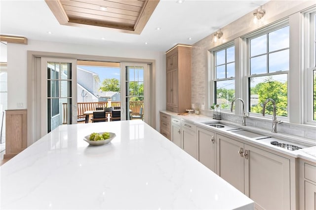 35 Coggeshall Ave, Newport, RI 02840 - kitchen with plenty of natural light, light stone counters, and a raised ceiling