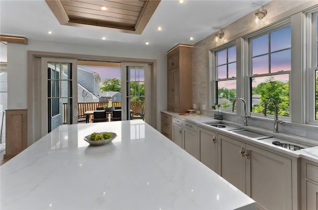 35 Coggeshall Ave, Newport, RI 02840 - kitchen with healthy amount of natural light, light stone countertops, recessed lighting, and a raised ceiling