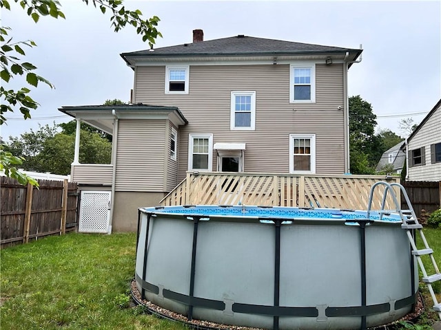 11 Potter Ave, West Warwick, RI 02893 - back of house featuring a chimney