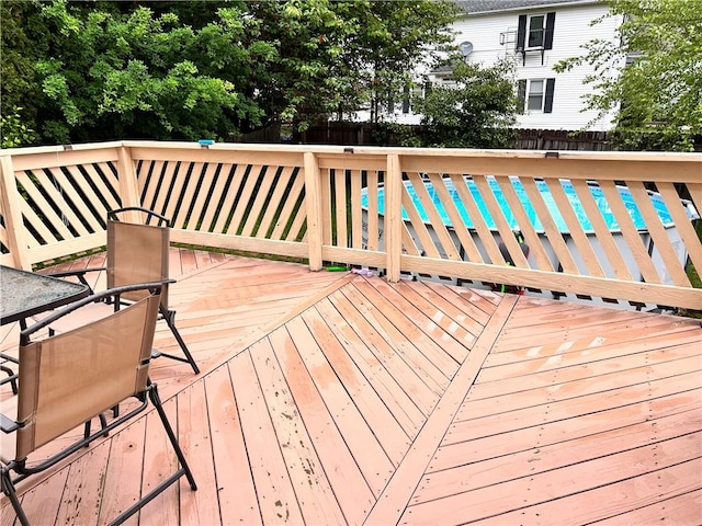 11 Potter Ave, West Warwick, RI 02893 - wooden deck with a fenced backyard, outdoor dining space, and an outdoor pool