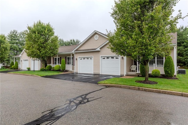 1285 Hartford Ave Unit 25, Johnston, RI 02919 - ranch-style home featuring an attached garage, asphalt driveway, and a front lawn