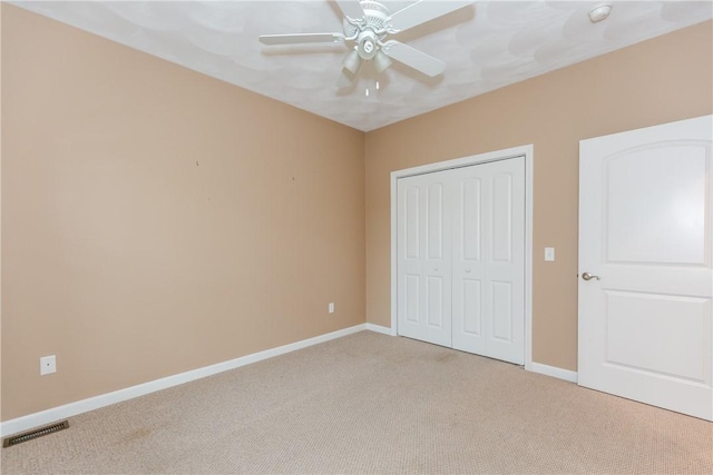 1285 Hartford Ave Unit 25, Johnston, RI 02919 - unfurnished bedroom with light colored carpet, a closet, and a ceiling fan