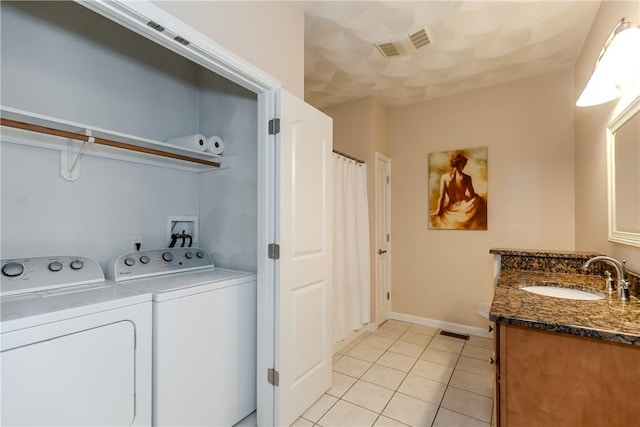1285 Hartford Ave Unit 25, Johnston, RI 02919 - laundry room with washer and dryer and light tile patterned floors