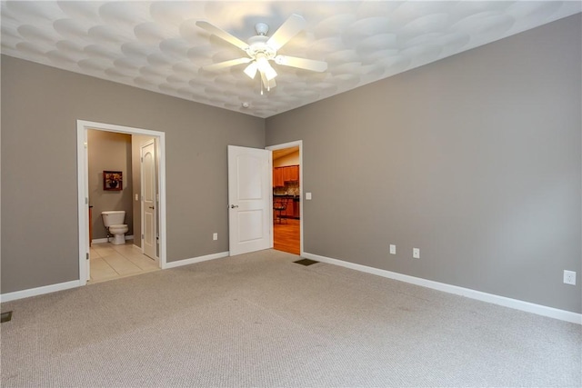1285 Hartford Ave Unit 25, Johnston, RI 02919 - unfurnished bedroom with light colored carpet, ensuite bathroom, and a ceiling fan