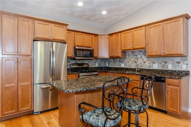 1285 Hartford Ave Unit 25, Johnston, RI 02919 - kitchen with stainless steel appliances, light wood-type flooring, backsplash, and recessed lighting