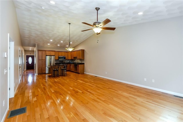 1285 Hartford Ave Unit 25, Johnston, RI 02919 - unfurnished living room featuring ceiling fan, light wood finished floors, recessed lighting, and vaulted ceiling