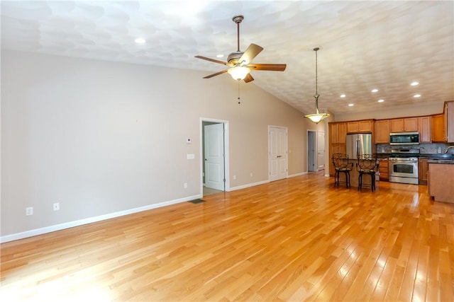 1285 Hartford Ave Unit 25, Johnston, RI 02919 - living room featuring ceiling fan, vaulted ceiling, light wood finished floors, and recessed lighting