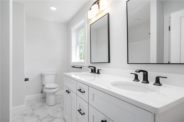 52 Governor St, Cumberland, RI 02864 - bathroom with marble finish flooring, double vanity, and recessed lighting