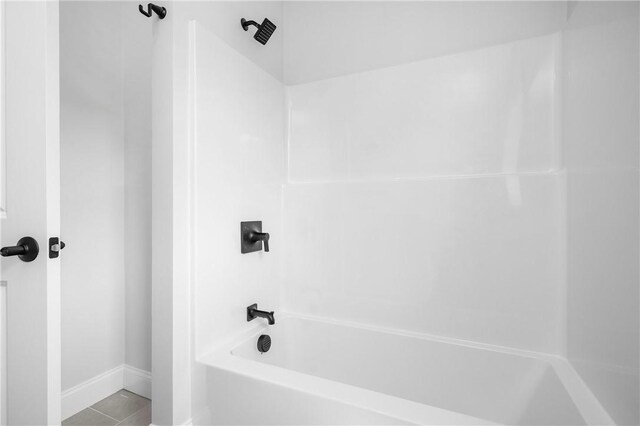 52 Governor St, Cumberland, RI 02864 - bathroom featuring washtub / shower combination and tile patterned flooring
