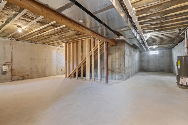 52 Governor St, Cumberland, RI 02864 - unfinished below grade area featuring water heater