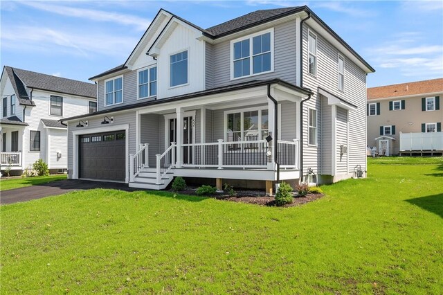 52 Governor St, Cumberland, RI 02864 - view of front facade featuring covered porch, a garage, a front yard, and driveway