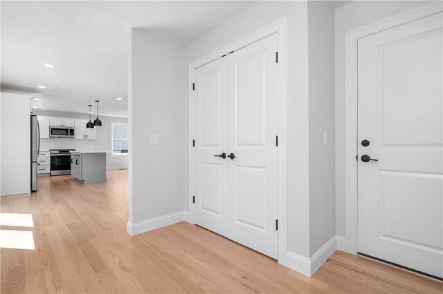 52 Governor St, Cumberland, RI 02864 - corridor with light wood-style flooring and recessed lighting