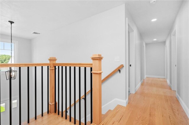52 Governor St, Cumberland, RI 02864 - hallway with an upstairs landing, light wood-type flooring, recessed lighting, and a chandelier