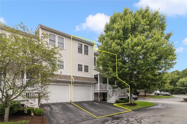 88 Red Brook Ln Unit 88, West Warwick, RI 02893 - multi unit property with a garage, asphalt driveway, and stairway
