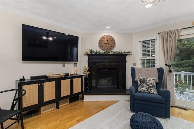 88 Red Brook Ln Unit 88, West Warwick, RI 02893 - living room featuring crown molding, wood finished floors, a premium fireplace, and recessed lighting