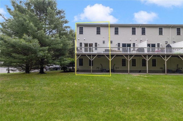 88 Red Brook Ln Unit 88, West Warwick, RI 02893 - rear view of property featuring a yard and a wooden deck