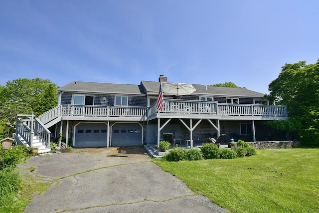 1 Butts Rock Rd, Little Compton, RI 02837 - view of front of property featuring driveway, a front yard, a wooden deck, and a chimney