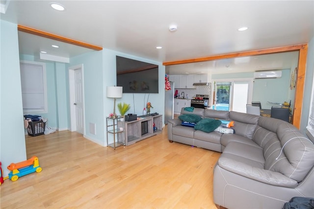 33 Williams St, New London, CT 06320 - living room featuring a wall unit AC, light wood-style flooring, and recessed lighting