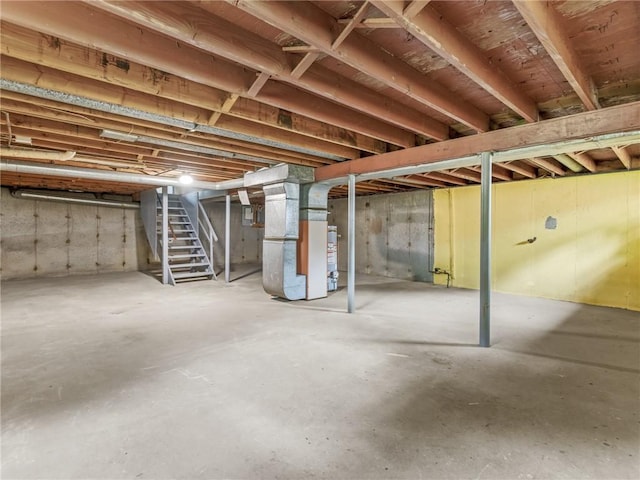 25 Martha Rd, East Providence, RI 02916 - unfinished below grade area with stairway, heating unit, and water heater