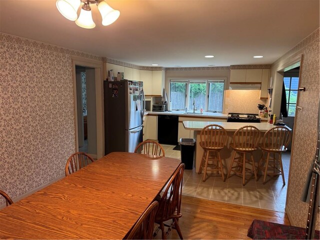 1 Grove St, Barrington, RI 02806 - dining room featuring light wood-style floors and wallpapered walls