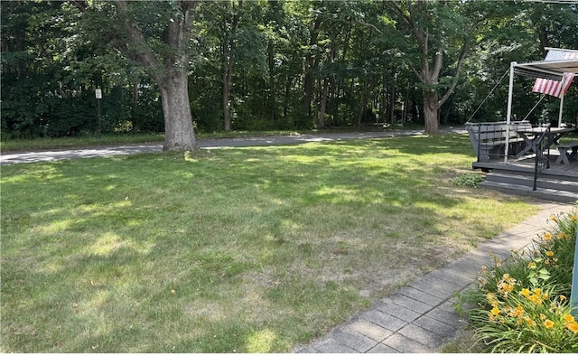 1 Grove St, Barrington, RI 02806 - view of green lawn with a deck