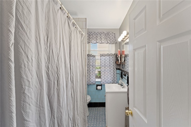 313 Branch Ave, Providence, RI 02904 - full bathroom featuring vanity, tile patterned floors, tile walls, and curtained shower