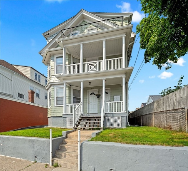 313 Branch Ave, Providence, RI 02904 - view of front facade with a balcony and a porch