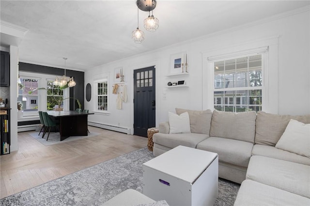 110 Spofford Ave, Warwick, RI 02888 - living room with baseboard heating, a chandelier, ornamental molding, healthy amount of natural light, and a baseboard heating unit