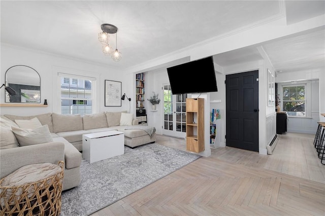 110 Spofford Ave, Warwick, RI 02888 - living area with a baseboard heating unit, ornamental molding, and a chandelier