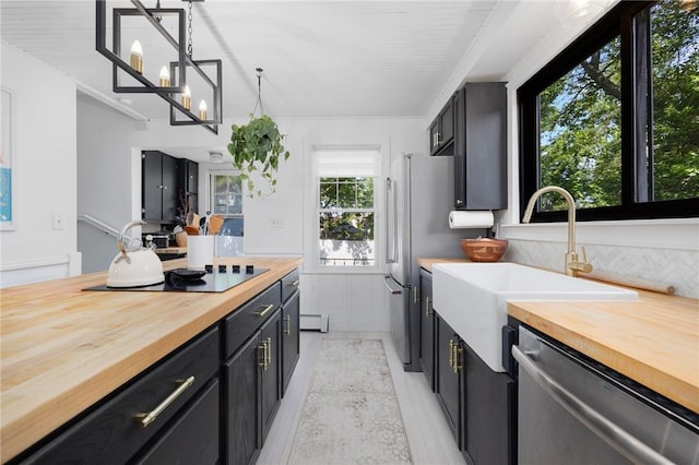 110 Spofford Ave, Warwick, RI 02888 - kitchen with butcher block counters, dishwasher, and dark cabinets