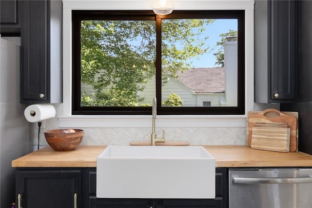 110 Spofford Ave, Warwick, RI 02888 - kitchen with stainless steel dishwasher, wood counters, healthy amount of natural light, and dark cabinets