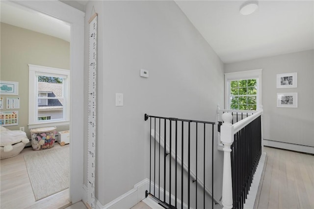 110 Spofford Ave, Warwick, RI 02888 - stairway featuring a baseboard heating unit and wood finished floors