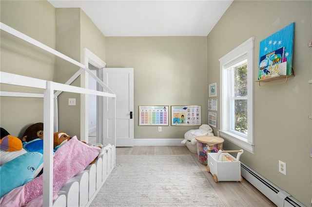 110 Spofford Ave, Warwick, RI 02888 - bedroom featuring baseboard heating and light wood finished floors