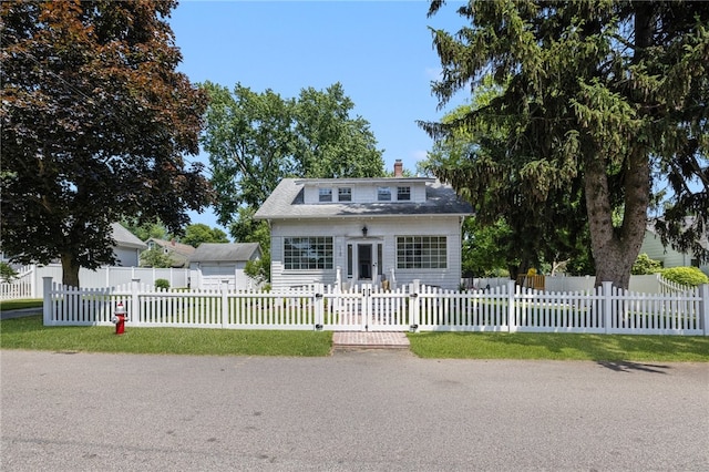 110 Spofford Ave, Warwick, RI 02888 - view of front of home with a chimney, a fenced front yard, and a gate
