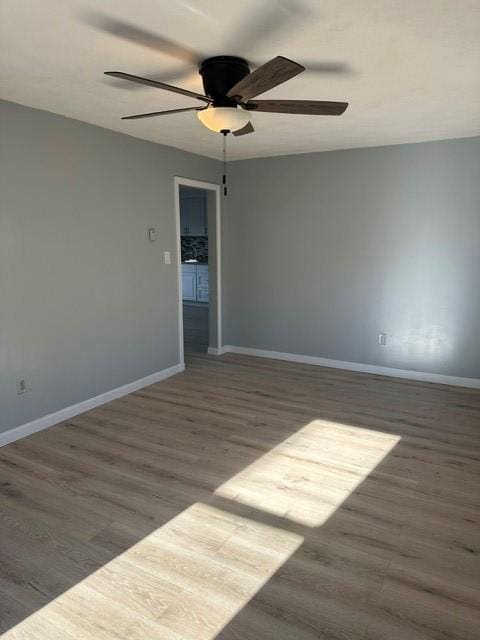 25 School St, West Warwick, RI 02893 - empty room featuring wood finished floors and ceiling fan