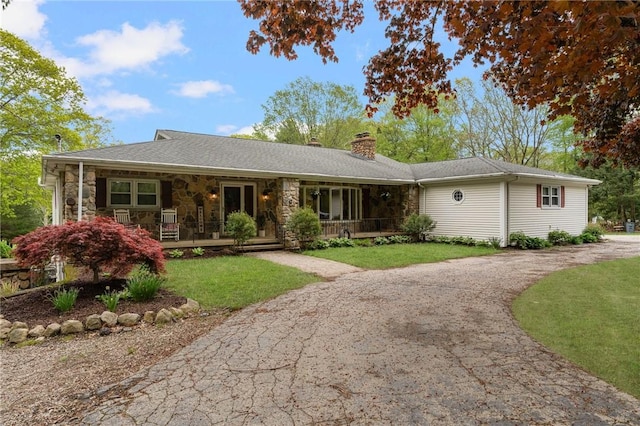 350 Shippee Rd, East Greenwich, RI 02818 - single story home with a porch, a chimney, a front yard, asphalt driveway, and stone siding