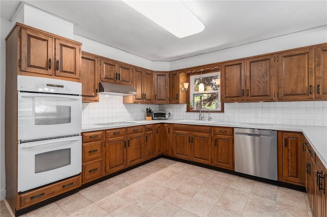 350 Shippee Rd, East Greenwich, RI 02818 - kitchen with dishwasher, white double oven, under cabinet range hood, light countertops, and stovetop