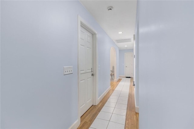 350 Shippee Rd, East Greenwich, RI 02818 - hall featuring light wood-style floors, arched walkways, and recessed lighting