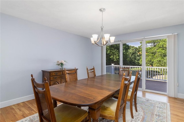 350 Shippee Rd, East Greenwich, RI 02818 - dining room with a chandelier and light wood-type flooring