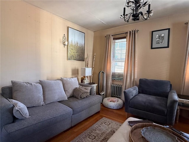 68 Grove St, Providence, RI 02909 - living area featuring radiator, wood finished floors, and a chandelier