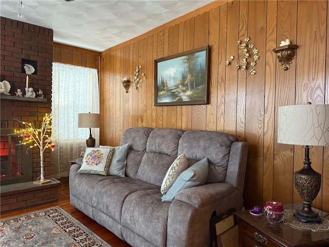 68 Grove St, Providence, RI 02909 - living room with wood walls, wood finished floors, and a fireplace