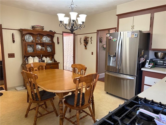 68 Grove St, Providence, RI 02909 - dining room featuring a chandelier and baseboards