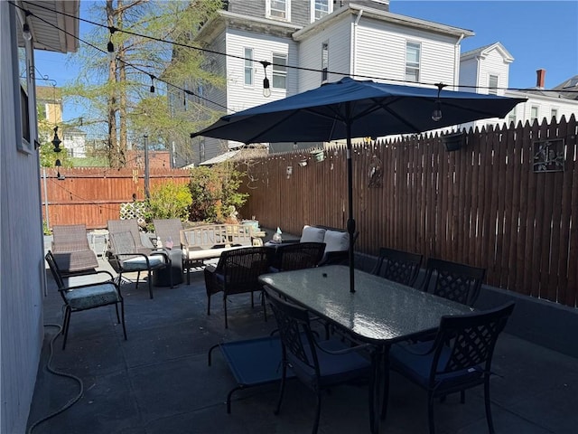 68 Grove St, Providence, RI 02909 - fenced backyard with outdoor dining space and a patio area