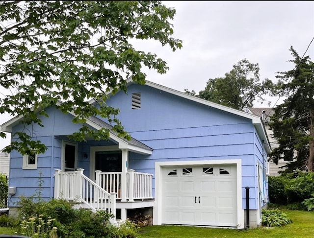 19 Lindberg Rd, Stonington, CT 06378 - view of front facade featuring a garage and a front yard