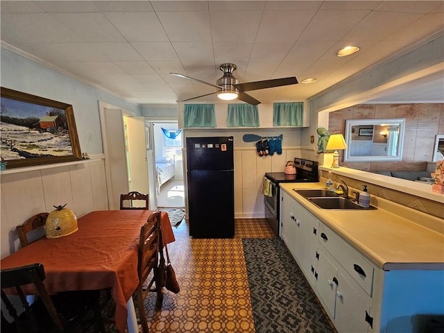 19 Lindberg Rd, Stonington, CT 06378 - kitchen with freestanding refrigerator, stainless steel electric range oven, crown molding, light countertops, and a ceiling fan